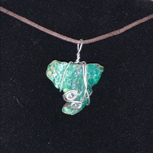 Green wrapped stone pendant